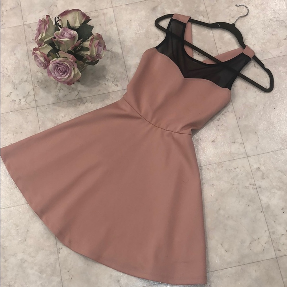 Mini pink and black dress with bow on back